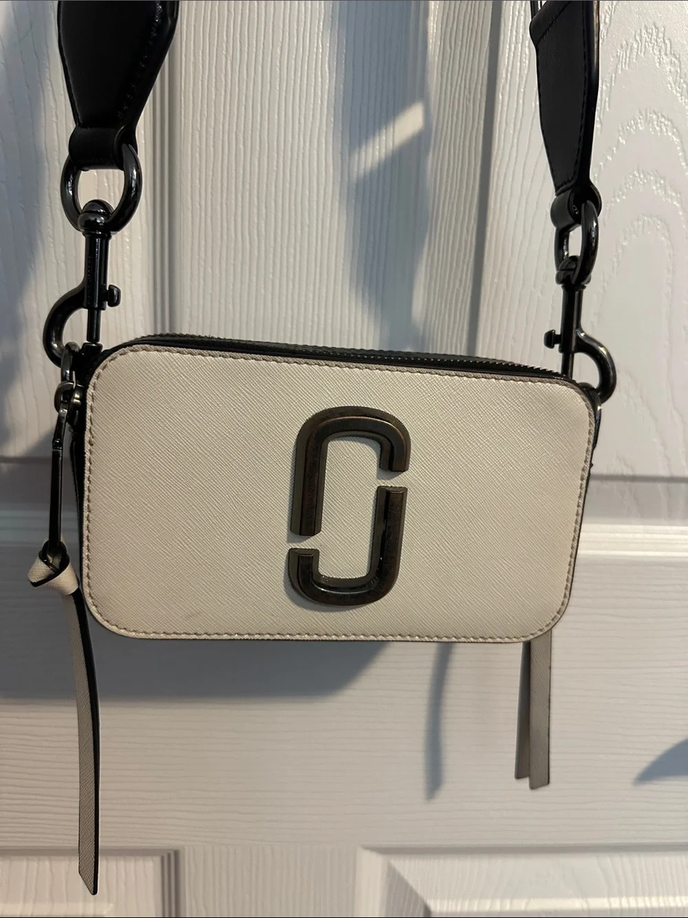 Marc Jacob’s Black and Cream Crossbody Camera Bag with Branded Strap